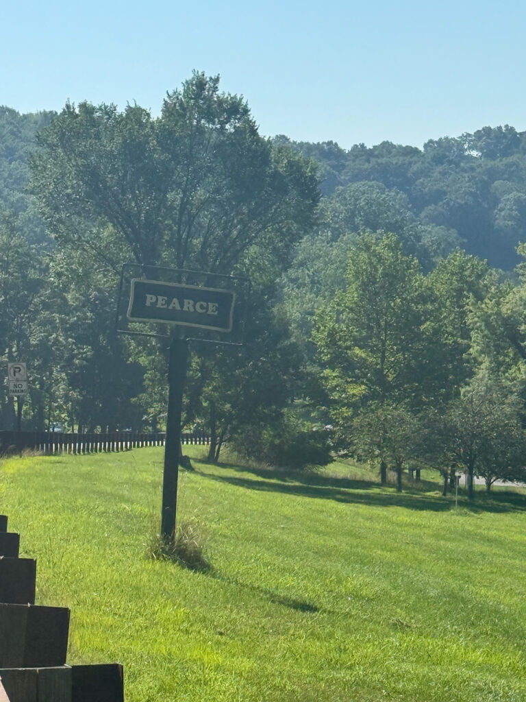 pearce sign in middle of green field