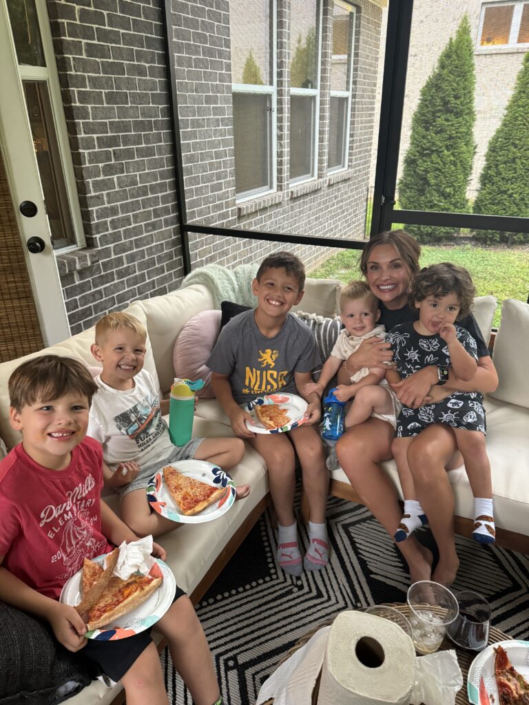 Carly Pearce posing with her bandmates' children